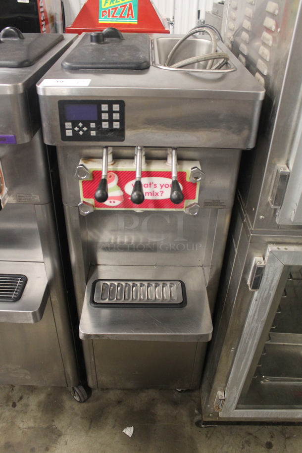 2014 Stoelting F231-18I2-OT2 Stainless Steel Commercial Floor Style Water Cooled 2 Flavor w/ Twist Soft Serve Ice Cream Machine on Commercial Casters. 208-240 Volts, 1 Phase.  - Image 1 of 6