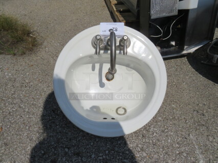 One 19 Inch Round Drop In Sink With Faucet.