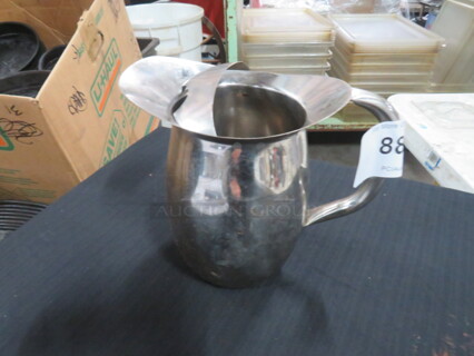One Stainless Steel Pitcher.