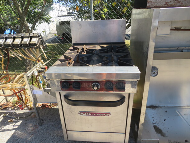 One Southbend Natural Gas 4 Burner Range With 2 Racks. 24X34X47