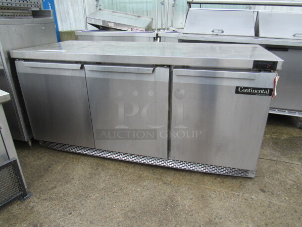 One SS 3 Door Continental Cooler, With 3 Racks, On Casters. Model# SW72. 72X30X34.5. $5254.83.