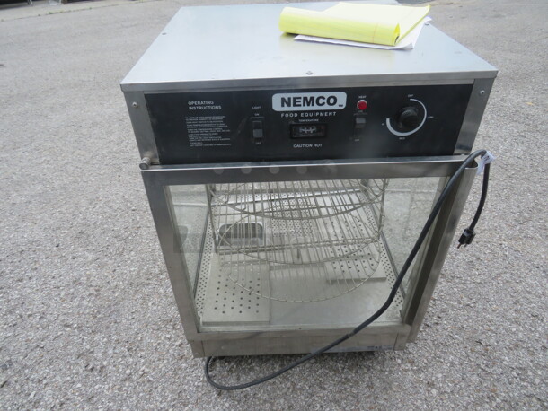 One Nemco Rotating 3 Tiered Pizza Merchandiser. Model# 6451. 120 Volt. 22X22X33.5. Missing 1 Side Glass. $2149.95 - Image 1 of 3