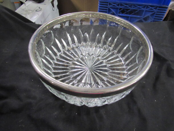 One Glass Bowl With Silver Rim.