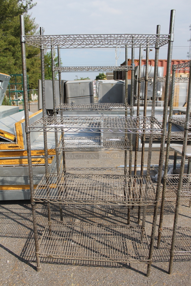 Chrome Finish 4 Tier Wire Shelving Unit. BUYER MUST DISMANTLE. PCI CANNOT DISMANTLE FOR SHIPPING. PLEASE CONSIDER FREIGHT CHARGES. - Image 1 of 4