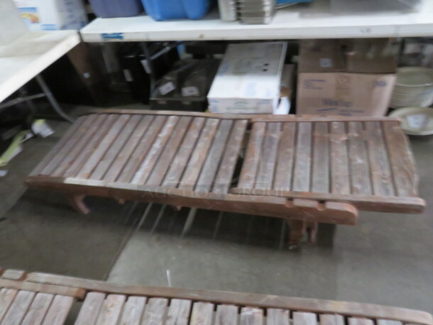 One Adjustable Wooden Chaise Lounger With 2 Wheels, And A Pullout Shelf. Needs A Lil Adjusting. 72X23 - Image 1 of 1