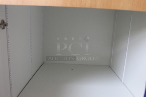BRAND NEW! Commercial 4 Door Cabinet In Wood Style Finish With White Shelves. - Image 2 of 4