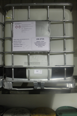 White Poly Tank in Metal Cage. BUYER MUST REMOVE.