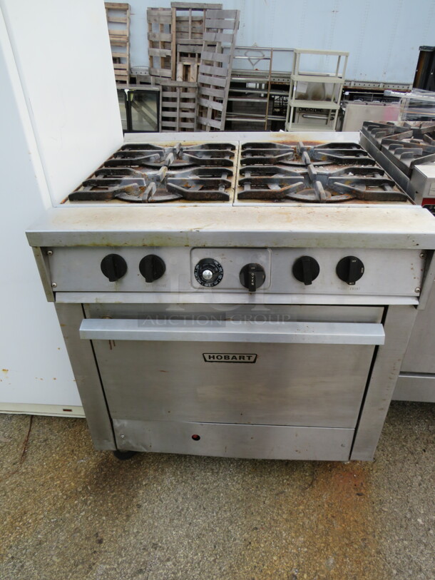 One Hobart Natural Gas 4 Burner Range With 1 Rack. 34X36X35 - Image 1 of 2