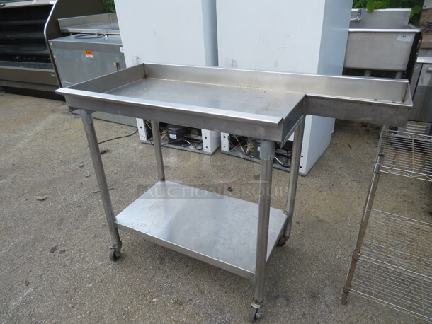 One Stainless Steel Table With SS Under Shelf On Casters. 49.5X24X37