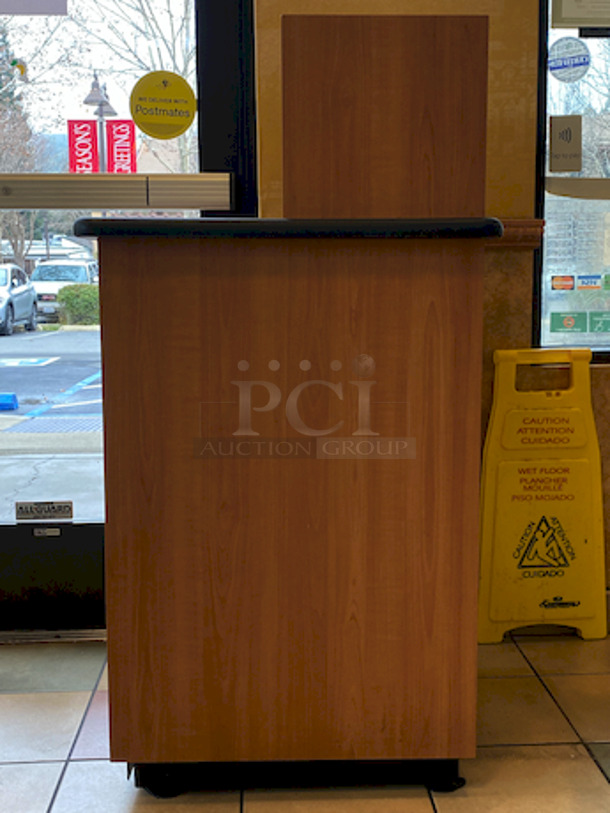 BEAUTIFUL! Plymold Round Drop Top Waste Receptacle with Tray Shelf, With 35 Gallon Liner. 
26x26x48

High pressure commercial laminate top and cabinet
Molded polyurethane edge designed for high traffic areas
8" Drop hole with Dur-A-Edge finish
Provides hygienic seal between laminate and receptacle edge
1.5" Radius corners on top
Rolled edge profile
1-1/8" thick 45 lb density particleboard core
Underside has phenolic backer to protect from moisture
Includes 35 gallon liner with casters
Tray shelf is 21.5"W x 11.25"D
Satin Nickel hinge and door pull
Leveling glides included - Image 3 of 4