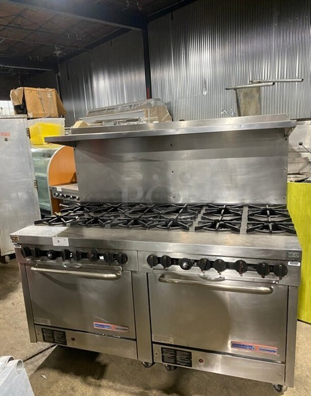 Southbend Commercial Natural Gas Powered 12 Burner Stove! With Raised Back Splash And Salamander Shelf! With 2 Full Size Oven Underneath! All Stainless Steel! On Casters! Working When Removed! - Item #1106413