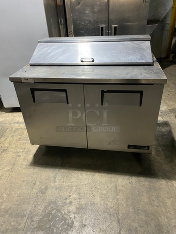 True Commercial Refrigerated Sandwich Prep Table! With 2 Door Storage Space Underneath! Poly Coated Racks! All Stainless! On Casters! Model: TSSU4812 SN: 4946429 115V 60HZ 1 Phase