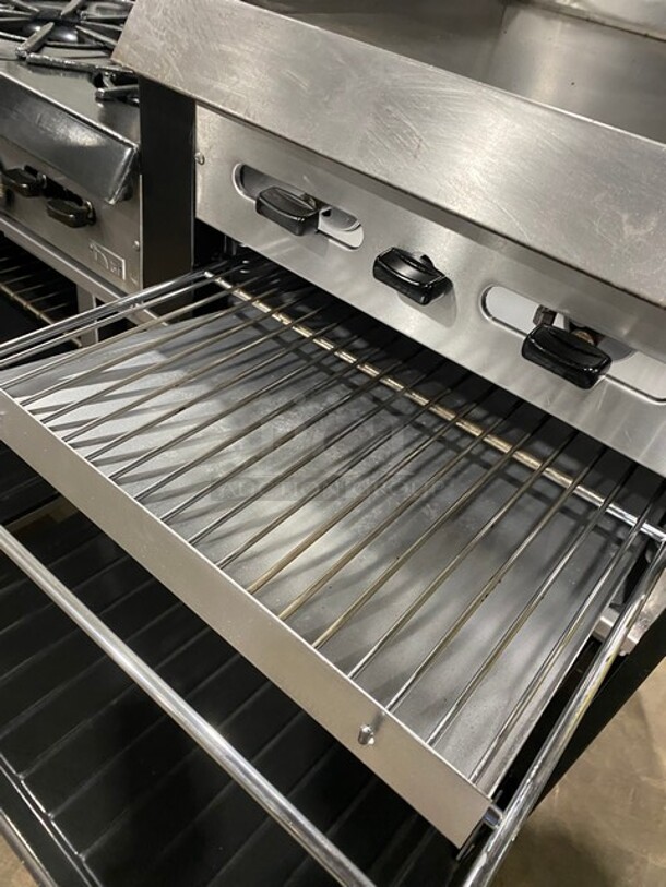AMAZING! Garland Commercial Natural Gas Powered 6 Burner Split Top With Right Side Flat Griddle! With 2 Full Ovens Underneath! With Back Splash & Overhead Salamander Shelf! All Stainless Steel! With Metal Oven Racks! On Casters!  - Image 10 of 12
