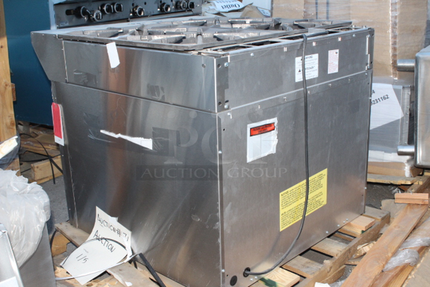 BRAND NEW SCRATCH & DENT! Garland / U.S. Range MST44S-E NAT Master Sentry Series Natural Gas 4 Burner 34" Range with Storage Base - 140,000 BTU. FEATURES: Electric ignition & flame fail on all burners *Thumbnail photo is shown with oven base please see additional photos. 	 - Image 6 of 6