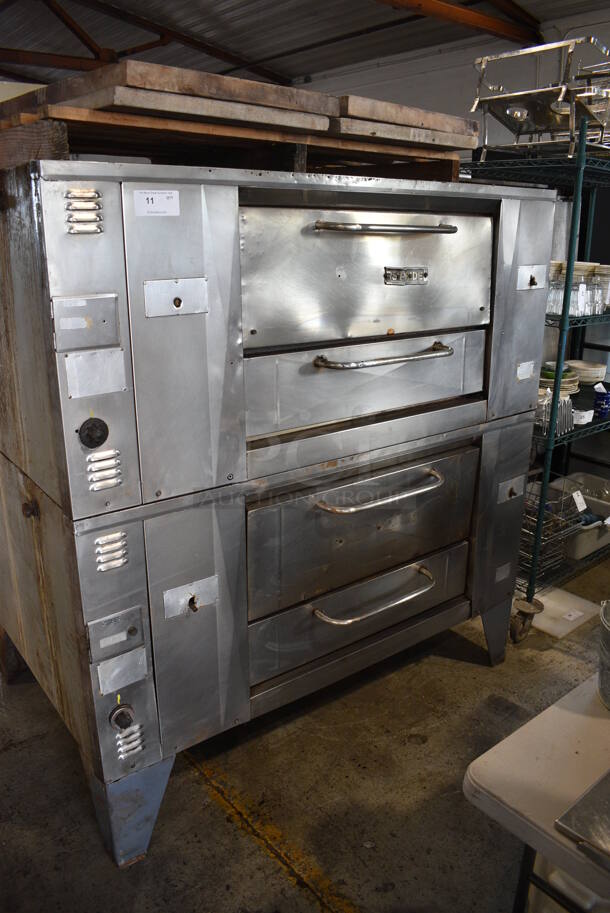 2 Baker's Pride Model D125 Stainless Steel Commercial Natural Gas Powered Single Deck Pizza Ovens on Legs. Comes w/ Cooking Stones! 125,000 BTU. 65x43x70. 2 Times Your Bid!