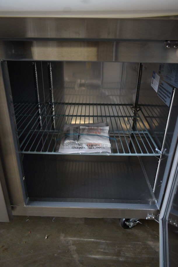 BRAND NEW SCRATCH AND DENT! 2023 Avantco 178SSPPT3 Stainless Steel Commercial Refrigerated Pizza Prep Table on Commercial Casters. 115 Volts, 1 Phase. Tested and Working! - Image 11 of 12