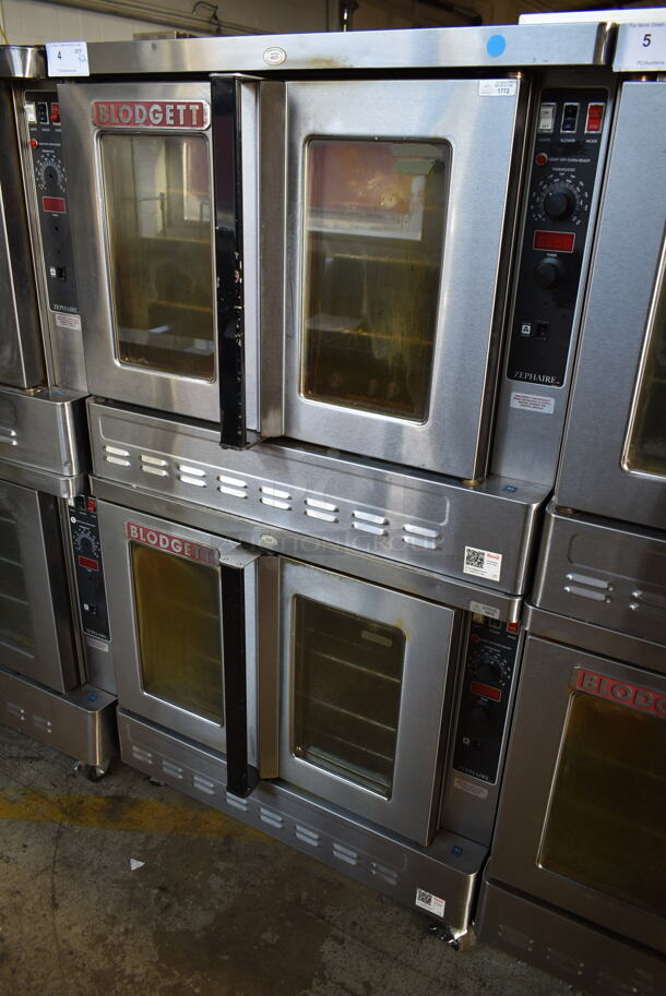 2 Blodgett Zephaire-200-G Stainless Steel Commercial Natural Gas Powered Full Size Convection Ovens w/ View Through Doors, Metal Oven Racks and Thermostatic Controls on Commercial Casters. 60,000 BTU. 2 Times Your Bid!