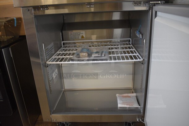 BRAND NEW SCRATCH AND DENT! Avantco Model 178AWT27FHC Stainless Steel Commercial Single Door Worktop Freezer w/ Poly Coated Rack on Commercial Casters. 115 Volts, 1 Phase. 27x29.5x39. Tested and Working! - Image 5 of 7