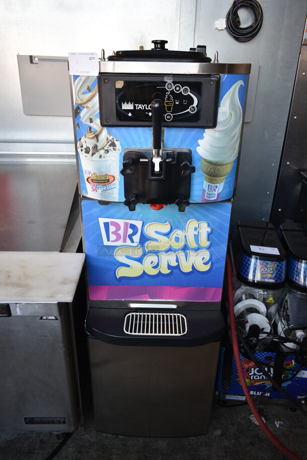 Taylor C709-27 Stainless Steel Commercial Floor Style Water Cooled Single Flavor Soft Serve Ice Cream Machine on Commercial Casters. 208-230 Volts, 1 Phase.