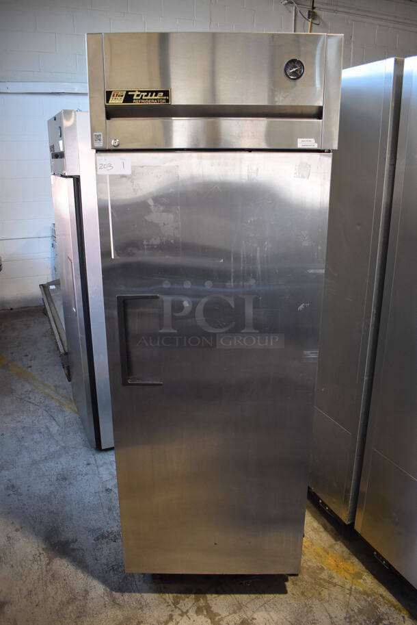2011 True TG1R-1S Stainless Steel Commercial Single Door Reach In Cooler w/ Poly Coated Racks on Commercial Casters. 115 Volts, 1 Phase. Tested and Working! 29x35x83