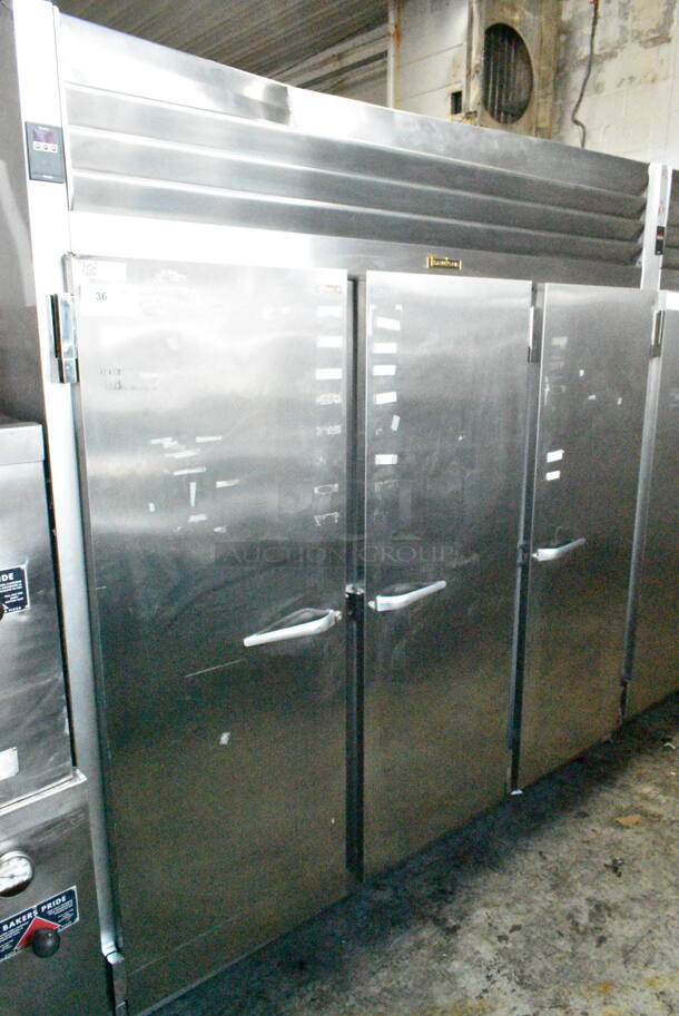 Traulsen G31010JC ENERGY STAR Stainless Steel Commercial 3 Door Reach In Freezer w/ Poly Coated Racks on Commercial Casters. 115 Volts, 1 Phase. Tested and Powers On But Does Not Get Cold
 - Image 1 of 7