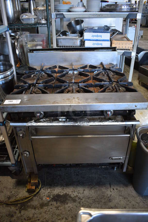 Jade Stainless Steel Commercial Natural Gas Powered 6 Burner Range w/ Oven and Backsplash. Leg Needs To Be Reattached. 36x38x42 - Image 2 of 8
