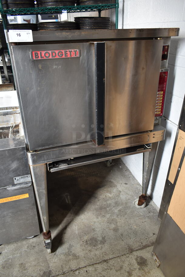 Blodgett Stainless Steel Commercial Electric Powered Full Size Convection Oven w/ Solid Doors, Metal Oven Racks and Metal Legs on Commercial Casters. 208-240 Volts, 3 Phase.