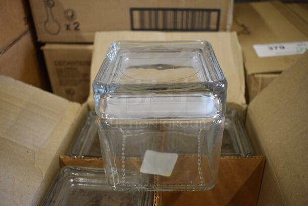 4 BRAND NEW IN BOX! Glass Containers. 4.25x4.25x5. 4 Times Your Bid!