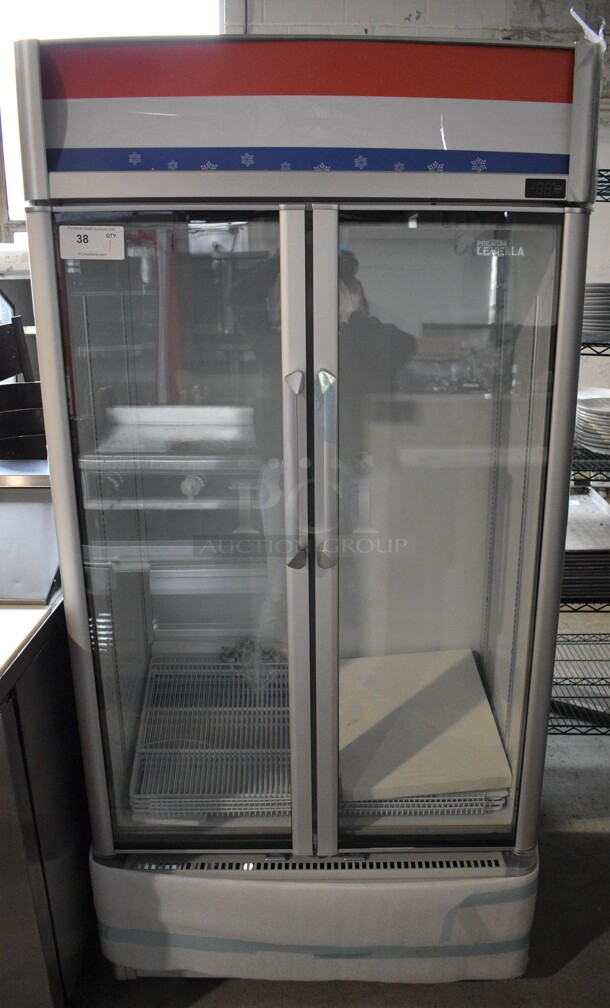 BRAND NEW! Premium Levella Model PRN165DX Metal Commercial 2 Door Reach In Cooler Merchandiser w/ Poly Coated Racks. 115 Volts, 1 Phase. 35x23x73. Tested and Working!