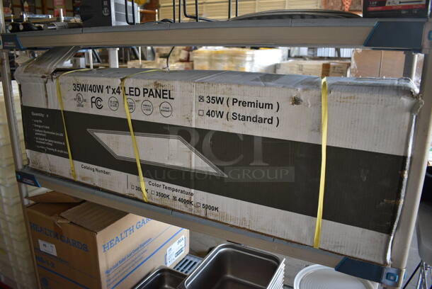 BRAND NEW IN BOX! 4 35W Premium 1'x4' LED Panels. 12x48