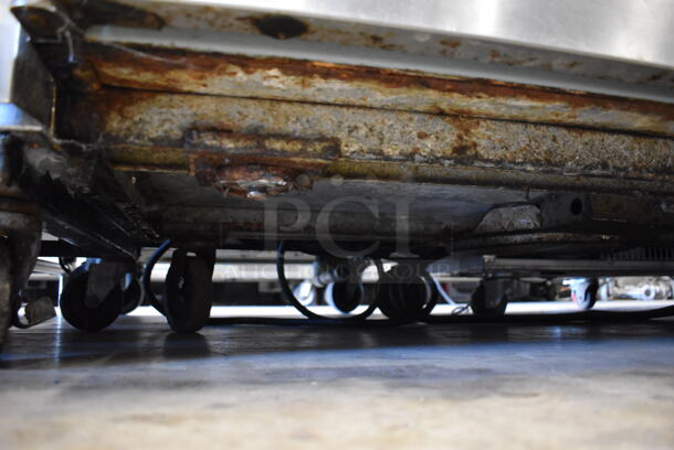 Delfield Stainless Steel Commercial Pizza Prep Table w/ 2 Tier Over Shelf on Commercial Casters. Missing 1 Caster. 115 Volts, 1 Phase. 76x32x69. Cannot Test - Unit Trips Breaker - Image 10 of 10