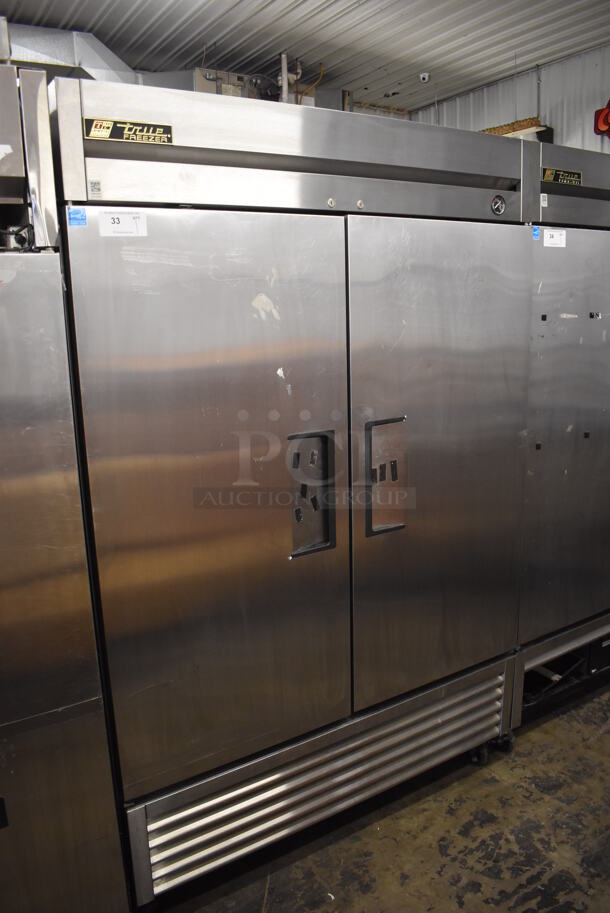 2013 True T-49F ENERGY STAR Stainless Steel Commercial 2 Door Reach In Freezer w/ Poly Coated Racks on Commercial Casters. 115 Volts, 1 Phase. 54x30x83. Tested and Working!