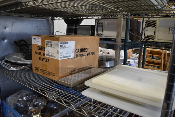 ALL ONE MONEY! Tier Lot of Various Items Including Metal Trays, NEW Cambro Poly Thermal Servers and Cutting Boards - Image 1 of 7