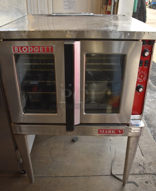 Blodgett Mark V Stainless Steel Commercial Electric Powered Full Size Convection Oven w/ View Through Doors, Metal Oven Racks and Thermostatic Controls on Metal Legs. 220-240 Volts, 1 Phase. 38x37x54