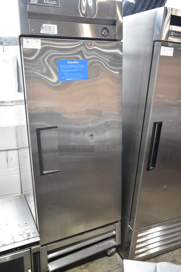 2017 True T-19F Stainless Steel Commercial Single Door Reach In Cooler w/ Poly Coated Racks on Commercial Casters. 1 Caster Needs To Be Reattached. 115 Volts, 1 Phase. Tested and Working! - Image 1 of 7