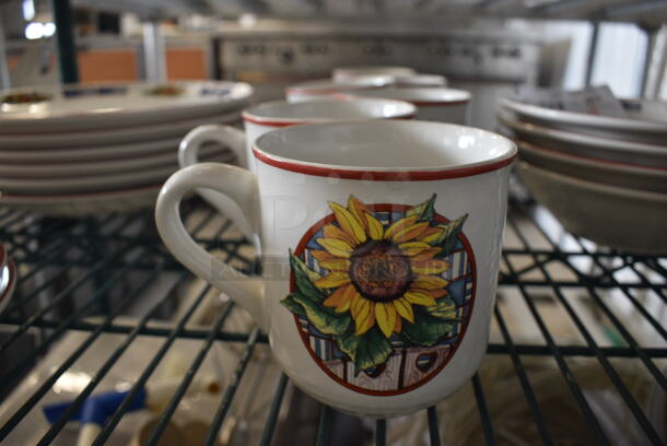 7 White Metal Sunflower Patterned Mugs. 5x3.5x4. 7 Times Your Bid!