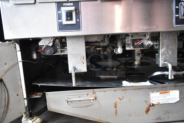 2020 Henny Penny OGA-323 ENERGY STAR Stainless Steel Commercial Natural Gas Powered 3 Bay Fryer w/ 3 Metal Fry Baskets on Commercial Casters. 255,000 BTU.  - Image 9 of 12