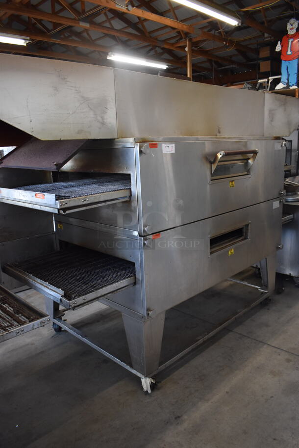 2 XLT 3270 Stainless Steel Commercial Natural Gas Powered Conveyor Pizza Oven on Commercial Casters. Comes w/ Hood / Vent. 180,000 BTU. 113x53x63, 99x37x22. 2 Times Your Bid! Picture of the Unit Before Removal Is Included In the Listing.