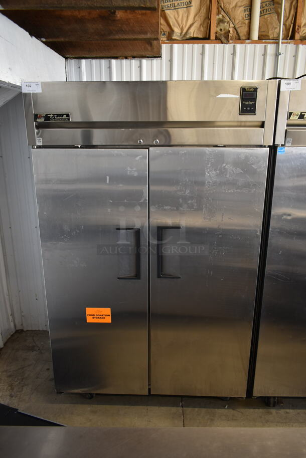 True TG2R-2S ENERGY STAR Stainless Steel Commercial 2 Door Reach In Cooler w/ Poly Coated Racks on Commercial Casters. 115 Volts, 1 Phase. Tested and Working! - Image 1 of 8