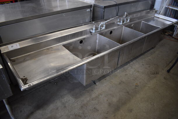 Stainless Steel Commercial 3 Bay Sink w/ Dual Drainboards, 2 Faucets and 2 Handle Sets. Does Not Have Legs. 124x25x25.5. Bays 24x18x14. Drainboard 24x21x2 - Image 1 of 5