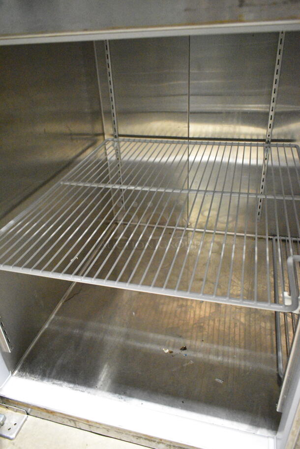 Endura MNR806SSG/0 Stainless Steel Commercial 6 Half Size Door Reach In Cooler Merchandiser w/ Poly Coated Racks and Commercial Casters. 115 Volts, 1 Phase. Tested and Working! - Image 9 of 11