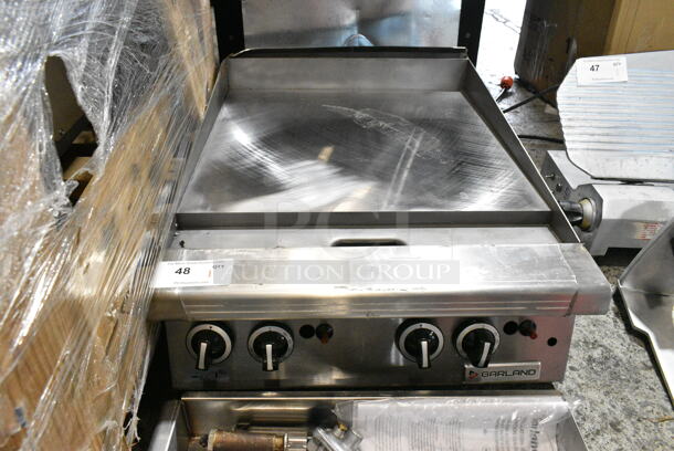 BRAND NEW SCRATCH AND DENT! 2024 Garland GTGG24-GT24M 24" Natural Gas Countertop Griddle with Thermostatic Controls.  - Image 3 of 10