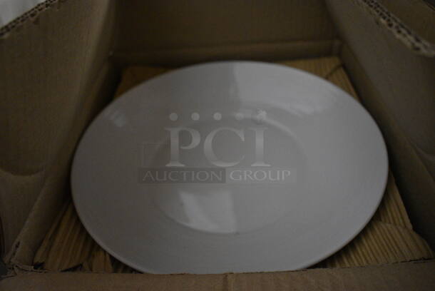 12 BRAND NEW IN BOX! Royal Porcelain Round White Plates. 11x11x1.5. 12 Times Your Bid!