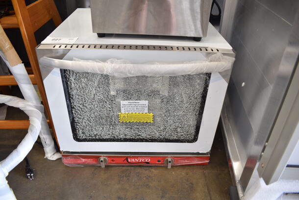 BRAND NEW SCRATCH AND DENT! Avantco 177CO28M Stainless Steel Commercial Countertop Electric Powered Half Size Convection Oven. See Pictures for Glass Damage. 208/240 Volts, 1 Phase.  - Image 1 of 5