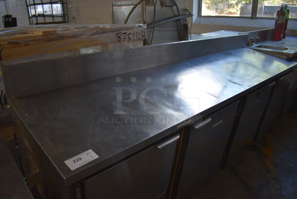 CustomCool Stainless Steel Commercial Work Top 4 Door Cooler w/ Backsplash. 96.5x24.5x45. Tested and Powers On But Does Not Get Cold - Image 2 of 6