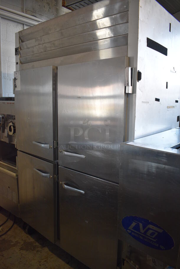 Traulsen Model G20000MC Stainless Steel Commercial 4 Half Size Door Reach In Cooler w/ Poly Coated Racks on Commercial Casters. 115 Volts, 1 Phase. 52x35x84. Tested and Working!