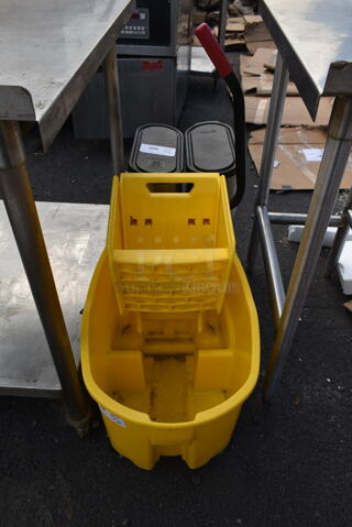 Rubbermaid Yellow Poly Mop Bucket w/ Wringing Attachment on Casters.