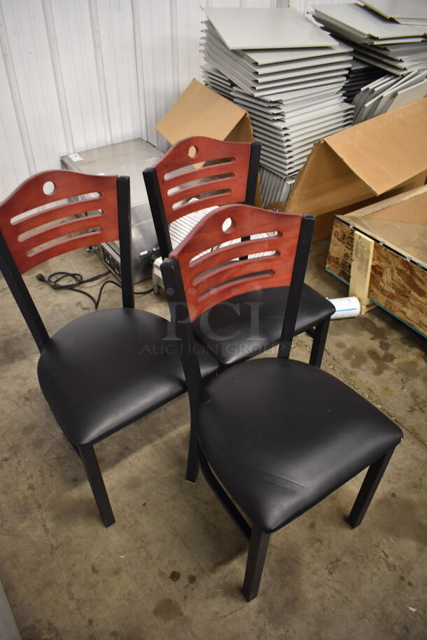 3 Black Cushioned Chairs With Wood Style Ladder Backs on Black Legs. 3 Times Your Bid! Cosmetic Condition May Vary.  - Image 2 of 3