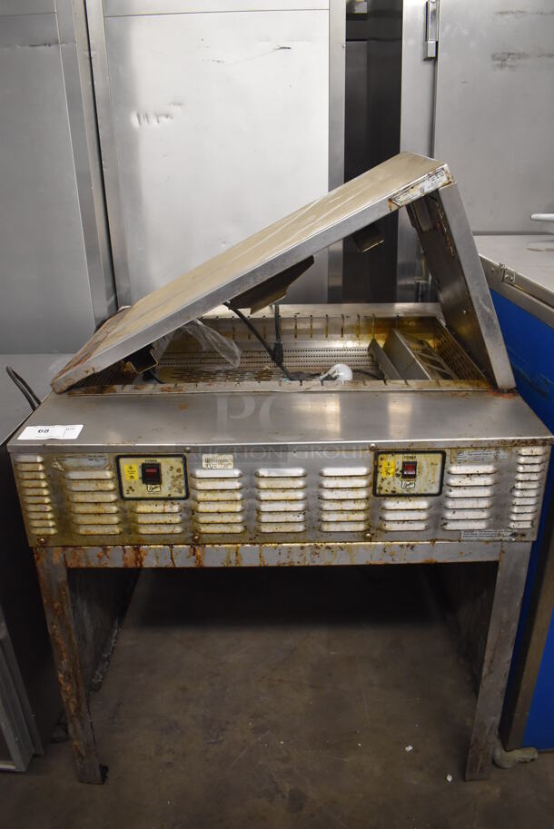 Duke Stainless Steel Commercial Dumping Station w/ Warming Strip. Missing 1 Bracket. 36x34x53. Tested and Powers On But Does Not Get Warm