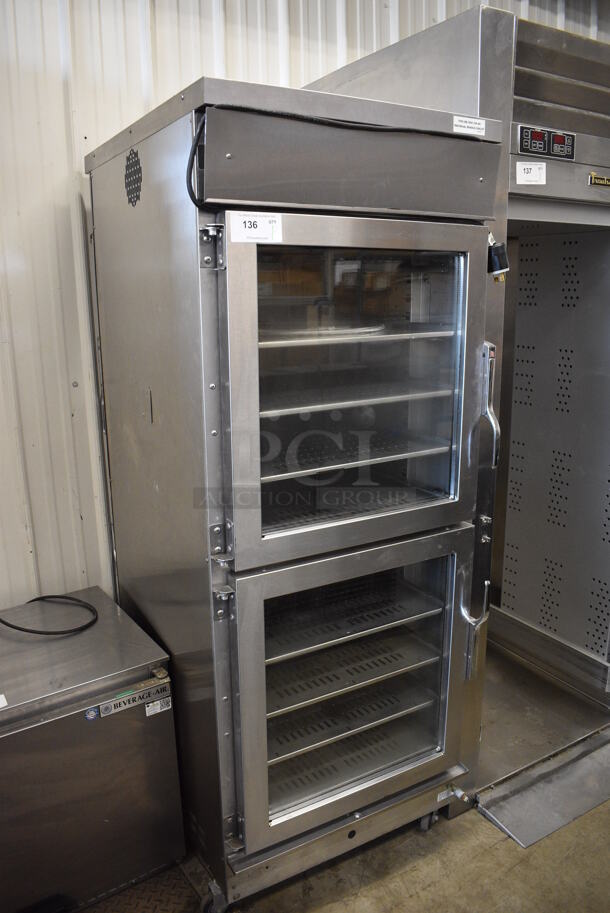 2012 Winston CVap Model HA4522ZE Stainless Steel Commercial 2 Half Size Door Reach In Warming Holding Rack on Commercial Casters. 120 Volts, 1 Phase. 27x33x73. Cannot Test Due To Plug Style